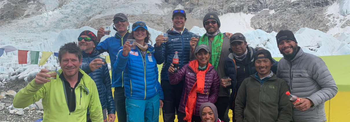 A toast to a safe climb at our base camp with the Khumbu Icefall behind