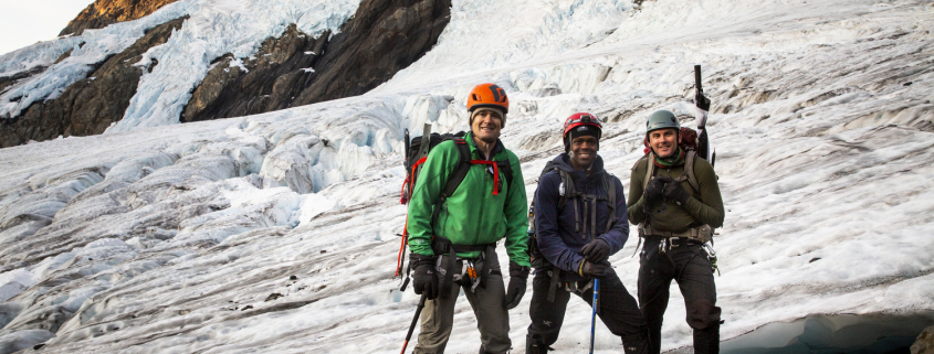 Team pose while climbing the Blue Glacier route on Mount Olympus in Olympic National Park