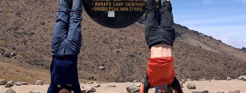 Celebrating arrival at the Lava Tower on Kilimanjaro with headstands!