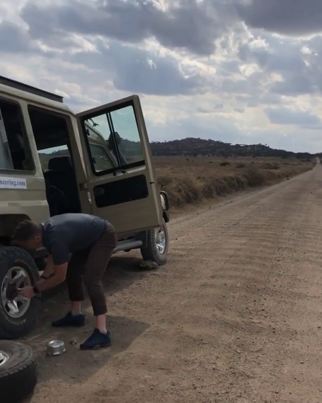 Lending a helping hand to fix a flat on the Serengeti
