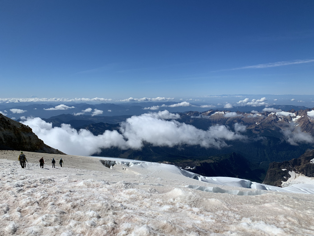 Climbing above the clouds on awesome conditions of Mt. Baker's glaciated slopes