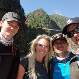 Chase M, Jenn D, Aang Phurba, and Garrett trekking to Namche