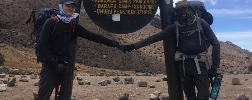 Fist bump for reaching the Lava Tower on Kilimanjaro