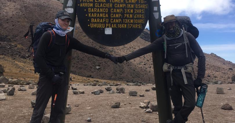 Fist bump for reaching the Lava Tower on Kilimanjaro