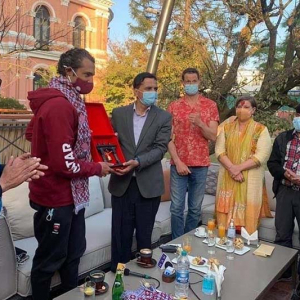Minister for Culture, Tourism and Civil Aviation Yogesh Bhattarai felicitates team leader Garrett Madison and Prince of Qatar Sheikh Mohammed Bin Abdulla Al Thani for a successful expedition to Mt Ama Dablam at Hotel Yak and Yeti in Kathmandu, on Saturday, November 14, 2020. Photo: THT