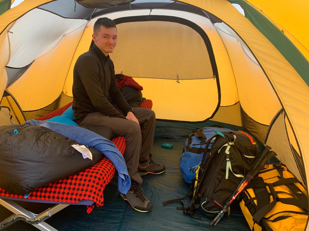 Chase enjoying his personal tent - Bandas trailhead, Mount Kenya