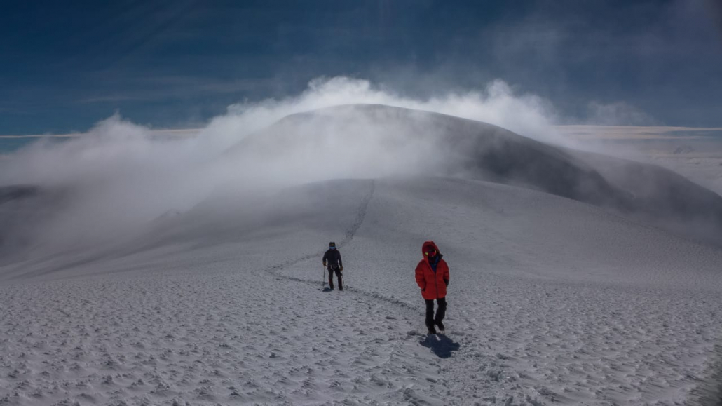 The walk across the saddle between the Veintimilla Summit (false summit) and the Whymper Summit (true summit)