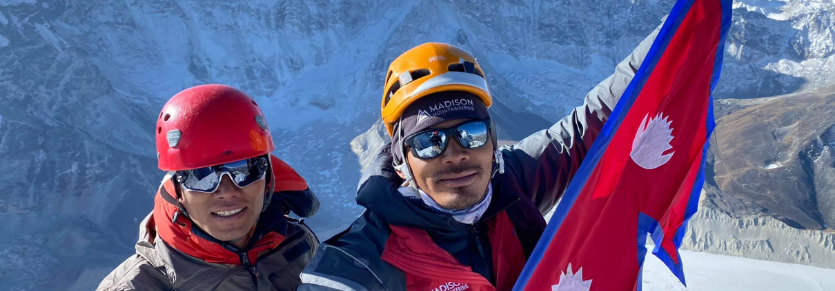 Guides Kumar and Ming Dorchi on the summit of Island Peak