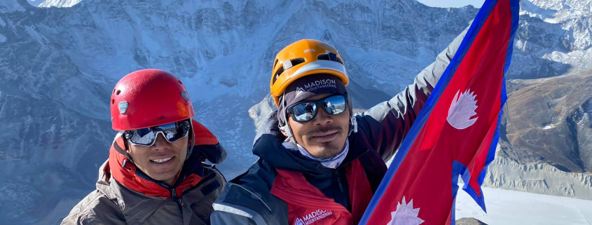 Guides Kumar and Ming Dorchi on the summit of Island Peak
