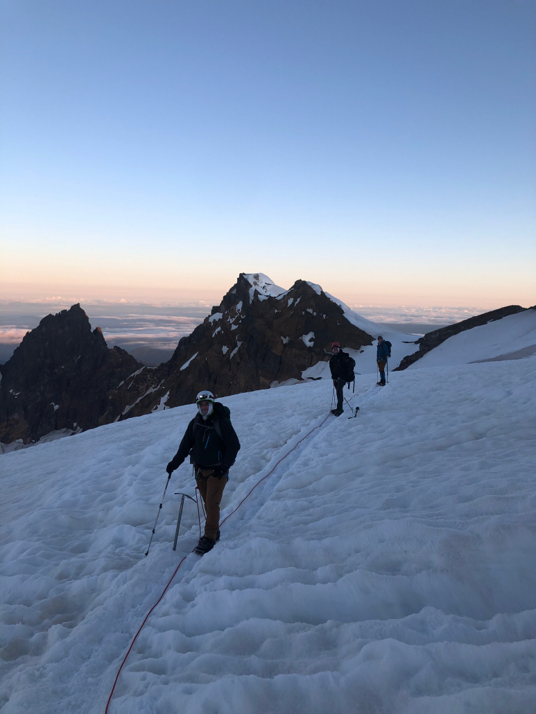Sunrise on ascending Mount Baker climbers