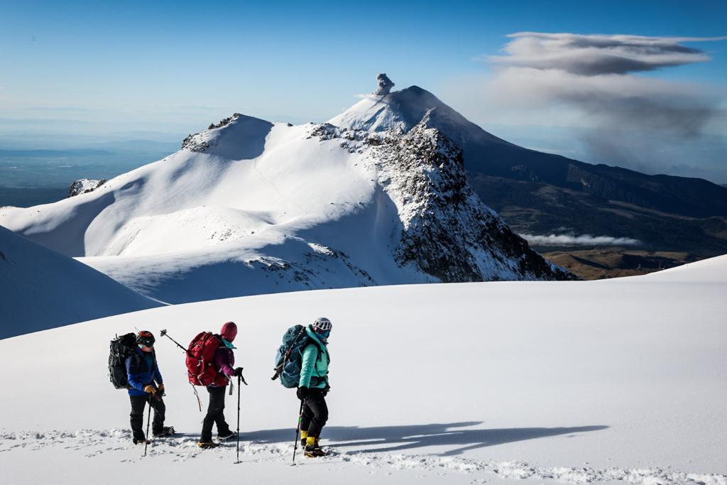 Our climbers watching Popocatépetl erupt while climbing to the summit of Iztaccihuatl in Mexico