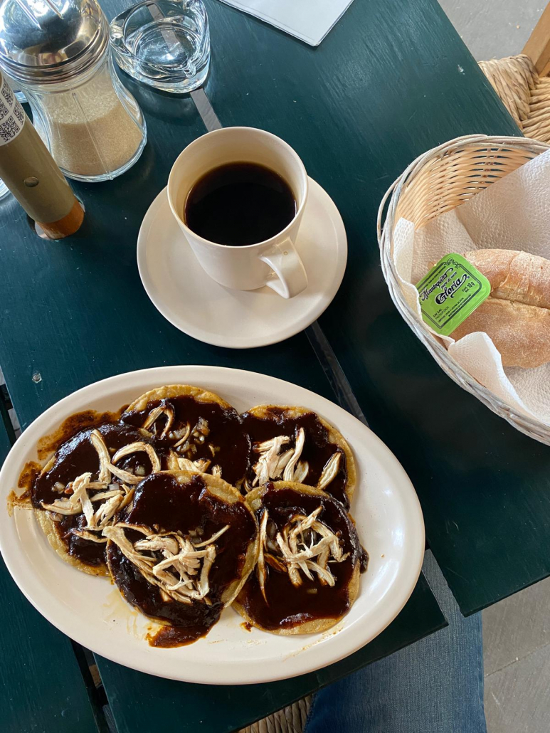 Chalupas with mole poblano for breakfast in Puebla, Mexico