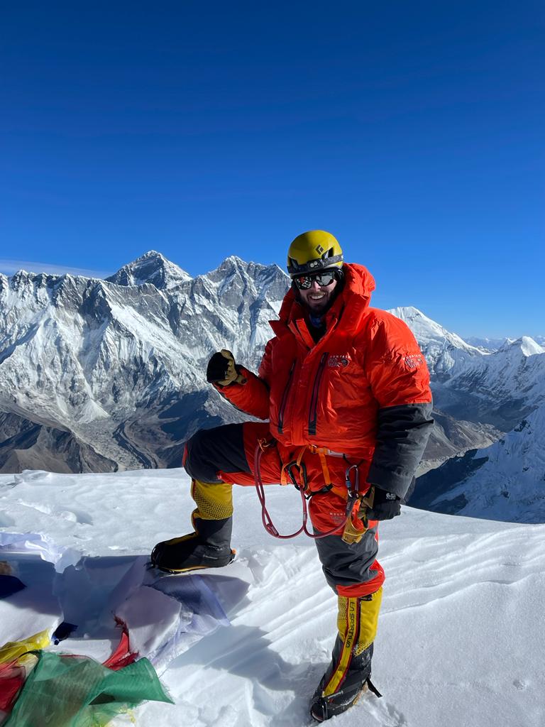 Climber Jonathan E. on the summit of Ama Dablam