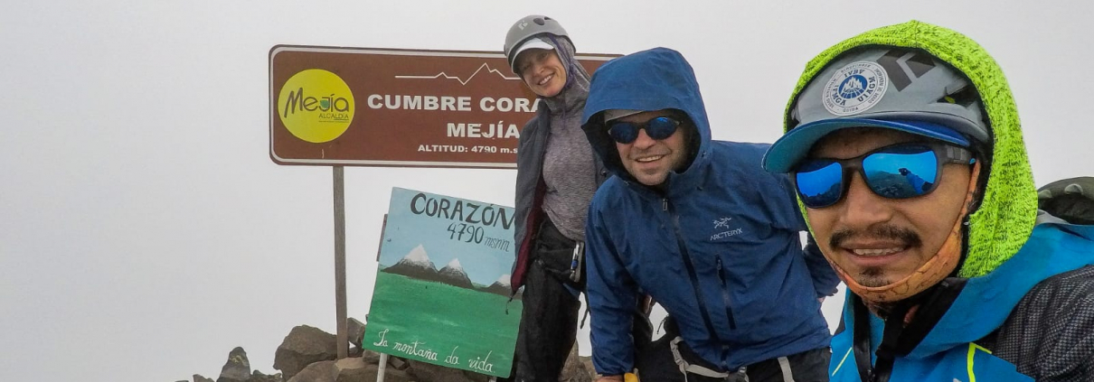 Guide Estalin Suárez and climbers Carter B. and Saskia J. on the summit of Corazón