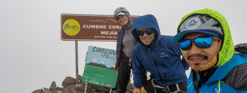 Guide Estalin Suárez and climbers Carter B. and Saskia J. on the summit of Corazón