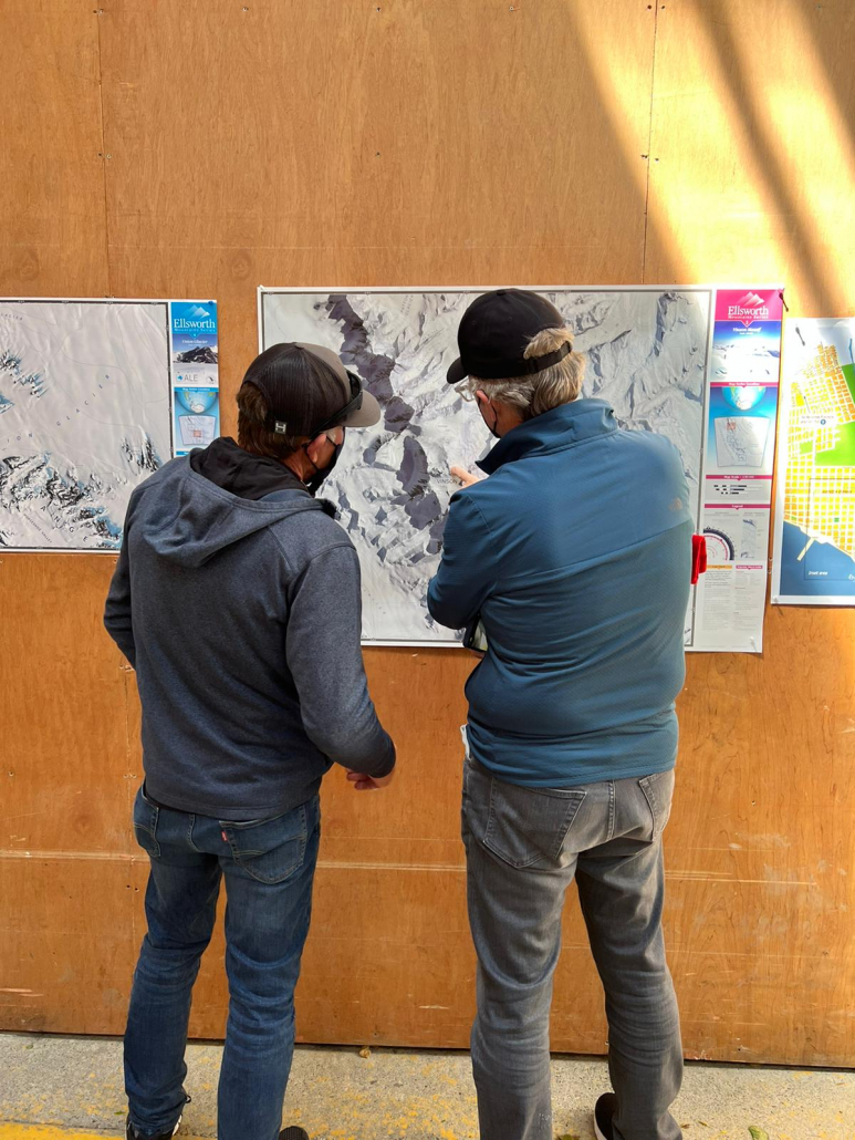 Ed Viesturs and climber Steve M. studying the Mount Vinson map