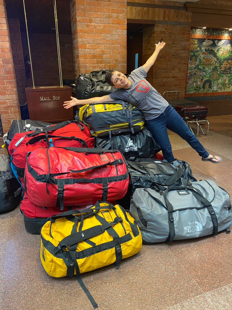 Climber Sara S. very excited about all the duffels and to be in Kathmandu!!