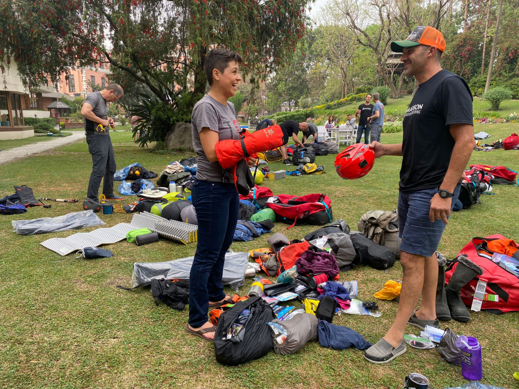 Sara S. chatting with Madison Mountaineering guide Cacho Beiza at the gear check