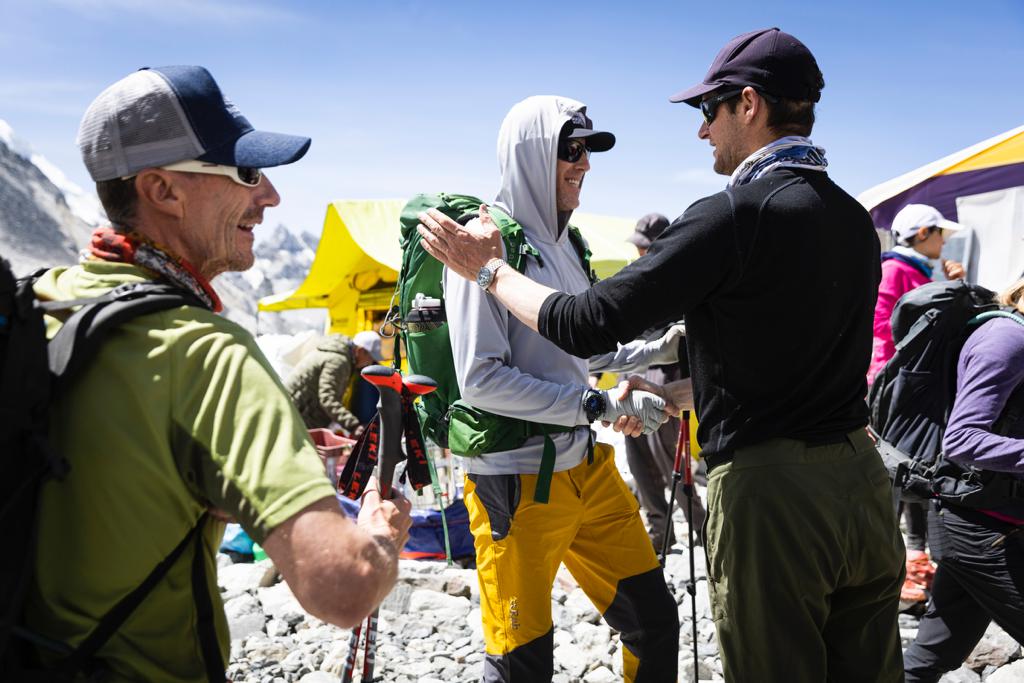 Garrett and Rob welcoming Everest climber Roi Negri base camp