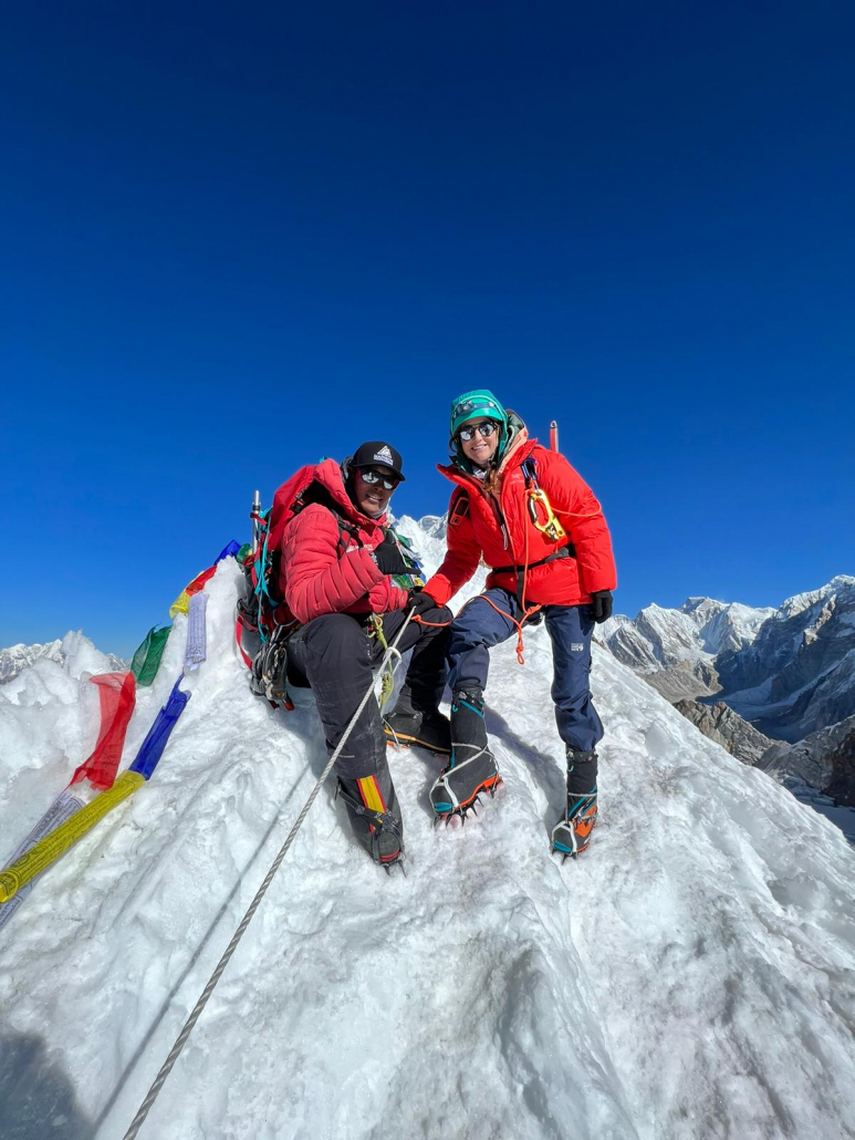 Climber Katherine Crociata and Tenji Sherpa on the summit of Lobuche East
