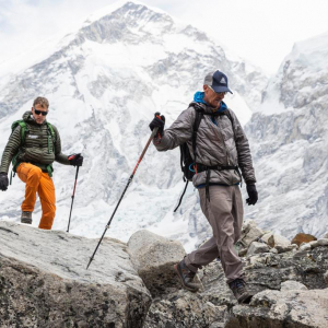 Guide Rob Smith hiking with climber Roi Negri on the flanks of Pumori above base camp