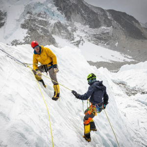 Guide Rob Smith and climber Chase Merriam sharpening skills at the base of the Khumbu Icefall