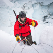 Climber Cameron Kenny ascending through the Khumbu Icefall