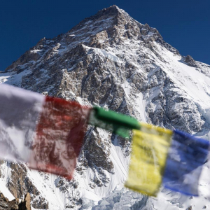 Prayer flags hanging in base camp far below the summit of K2 (📸: @terray_s)