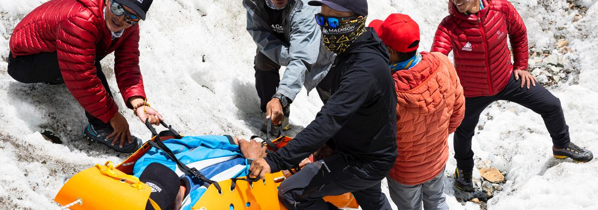 Members of our sherpa team practicing moving a victim in a rescue litter near base camp today (📸: @terray_s)