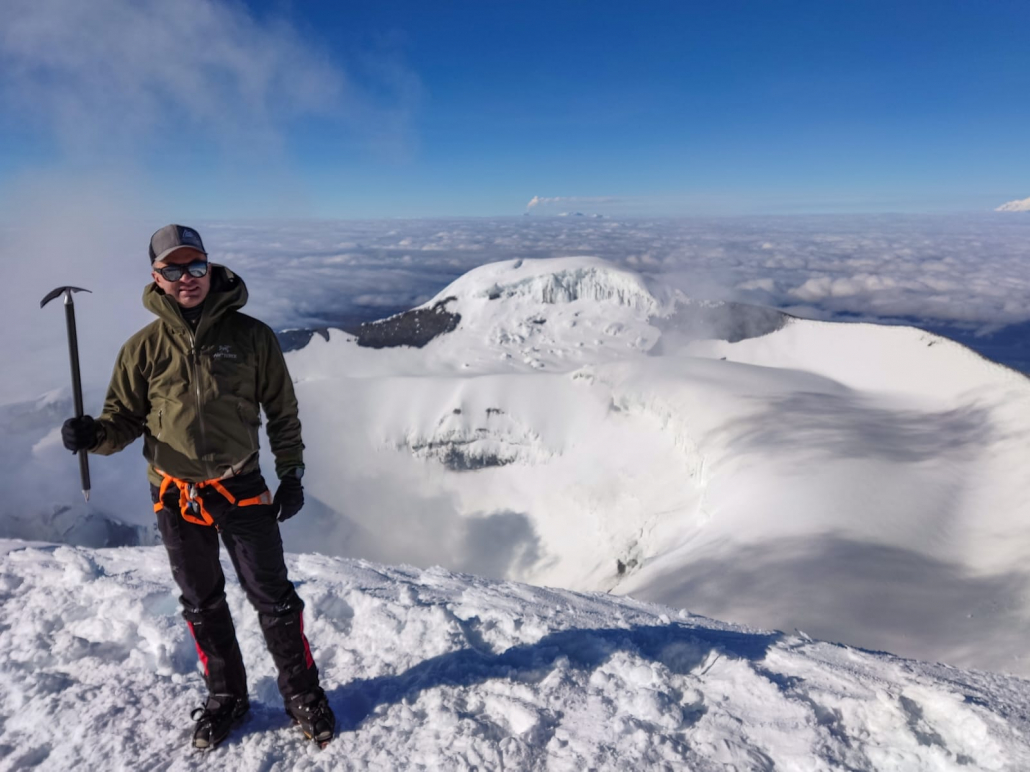 Climber Kevin G. celebrates reaching the summit of Cotopaxi