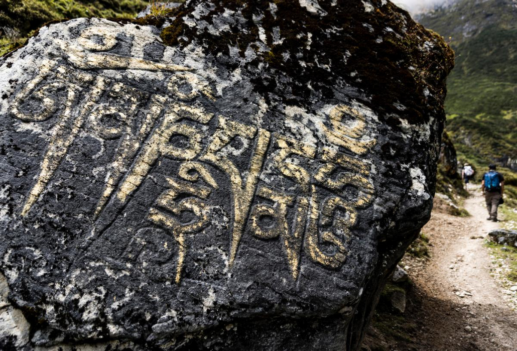 Buddhist mantras along the trail to Punggen. Photo: Terray Sylvester