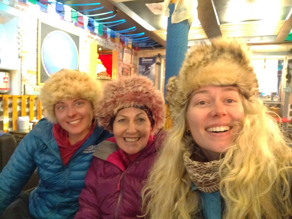 Guide, Hannah Smith with our climbers Mandy and Andrea in Namche Bazaar while trekking out from base camp.