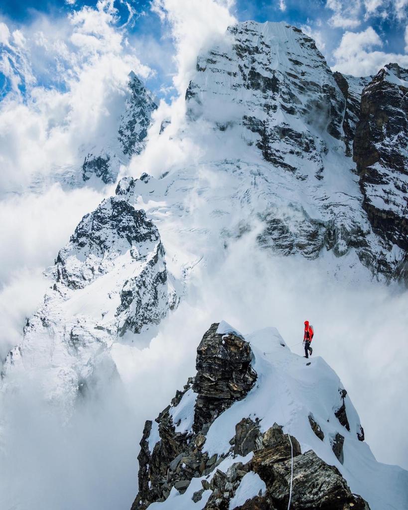 Climbers high in the alpine on the unclimbed peak. Photo: Ted Hesser