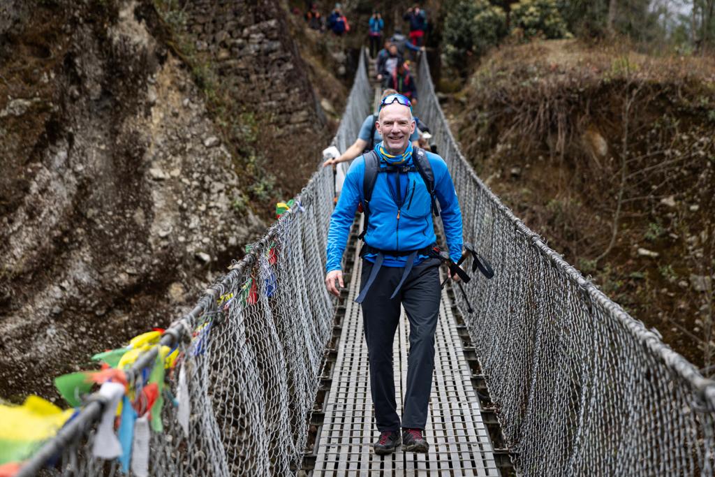 Climbers trekking across one of the many suspension bridges in the Khumbu Valley. Photo: Terray Sylvester