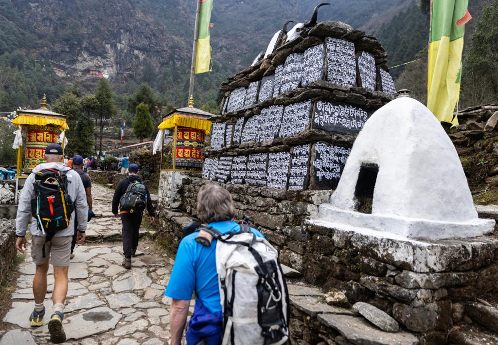 Walls of mani stones line the trail with prayer and meditation along the trek. Photo: Terray Sylvester