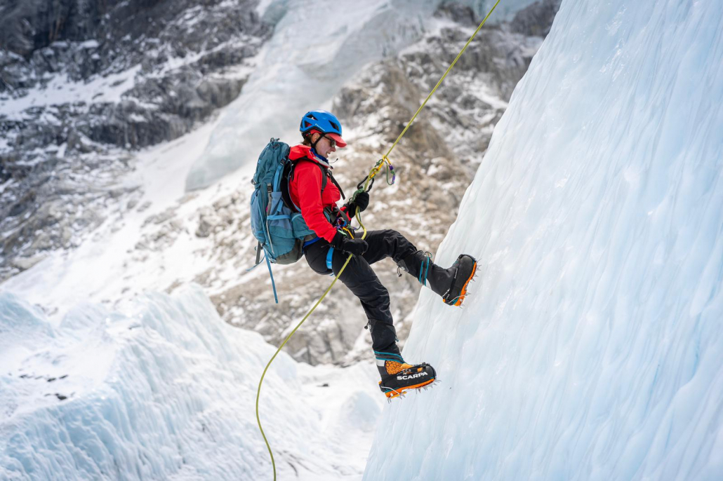 Climber, Debbie Bulten, rappelling down a Khumbu Glacier ice formation. (Photo: Terray Sylvester)