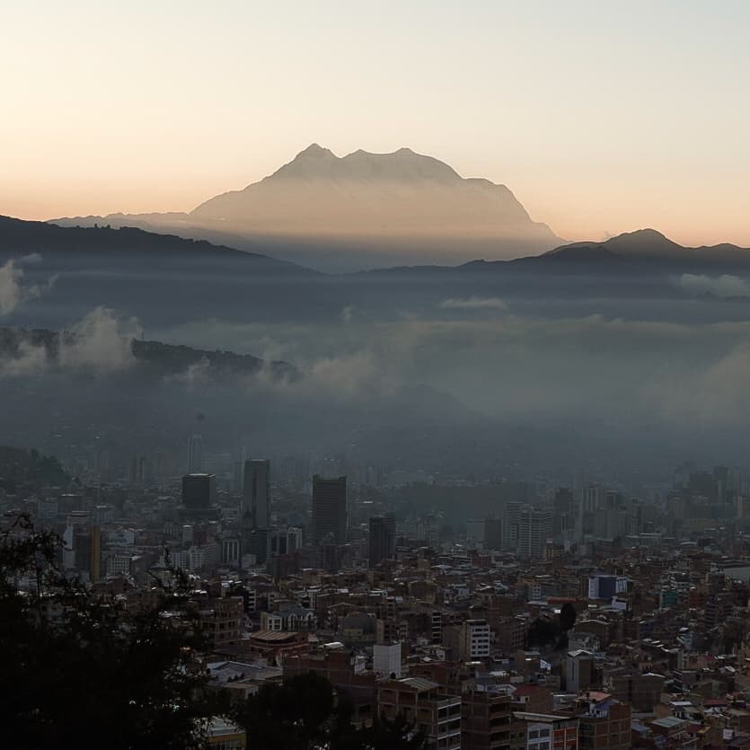 Towering peaks watching from afar over the city streets. Photo: Estalin Suárez