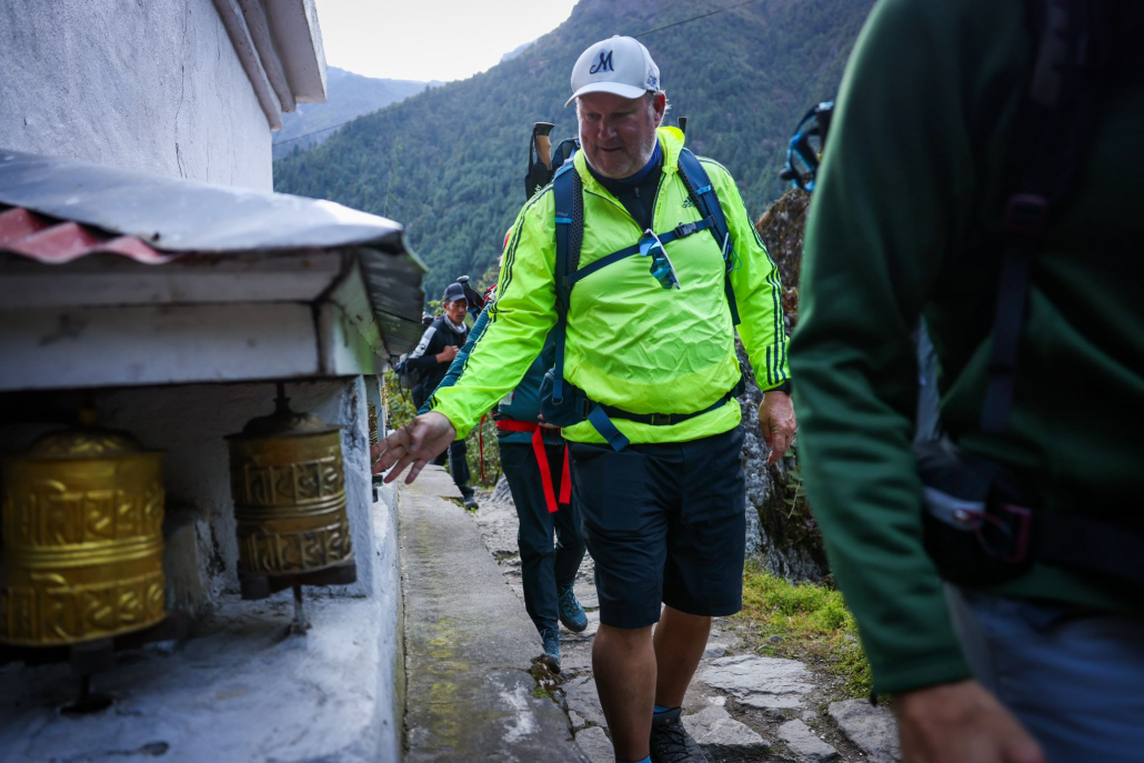 Everest Base Camp trekker, Kirk spinning prayer wheels en route to Phakding (photo by Terray Sylvester)
