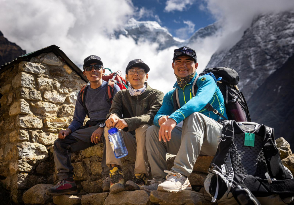 Dawa Tenji (left) and Aditya Rai (right), members of our excellent local staff, taking a break on the way to Tengboche (Photo by Terray Sylvester)