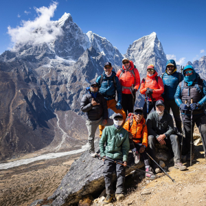 The team enjoying a sunny day at almost 5000m with Taboche and Cholatse in the distance (Photo by Terray Sylvester)