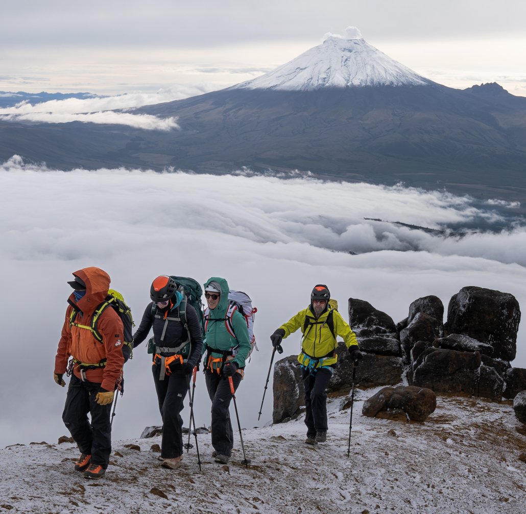 Ascending the ridge which leads the way towards the summit of Illiniza Norte with Cotopaxi behind (Photo by Estalin Suárez)