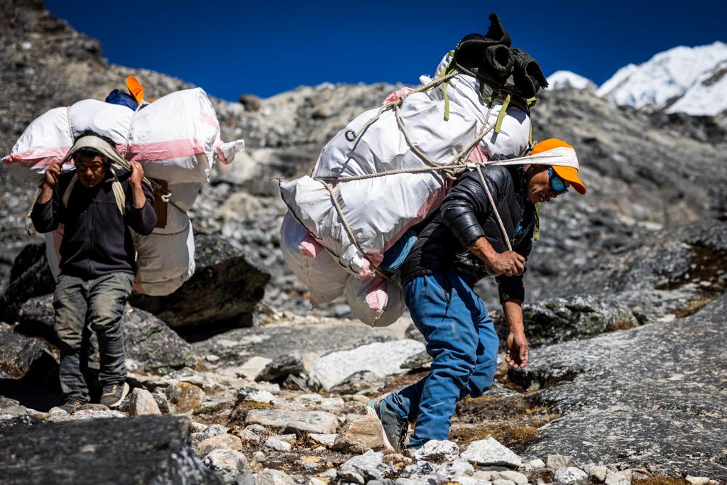 Our team carrying trash out of Lobuche East High Camp to be repurposed or disposed of out of the Khumbu Valley (Photo by Terray Sylvester)