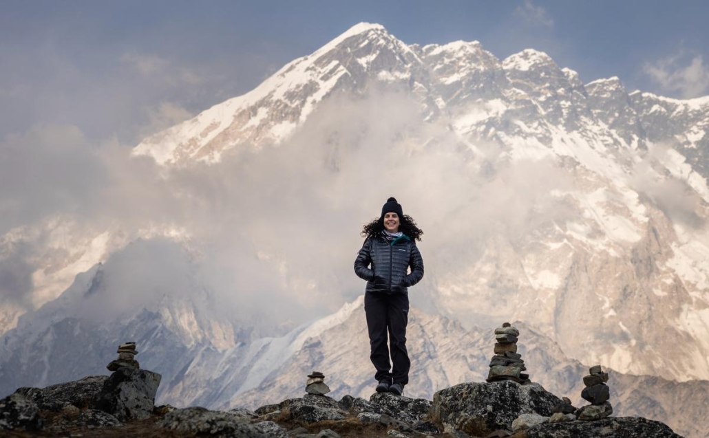 Climber Nelly Attar near Lobuche Village with Nuptse Range in the background. (Photo by Terray Sylvester)