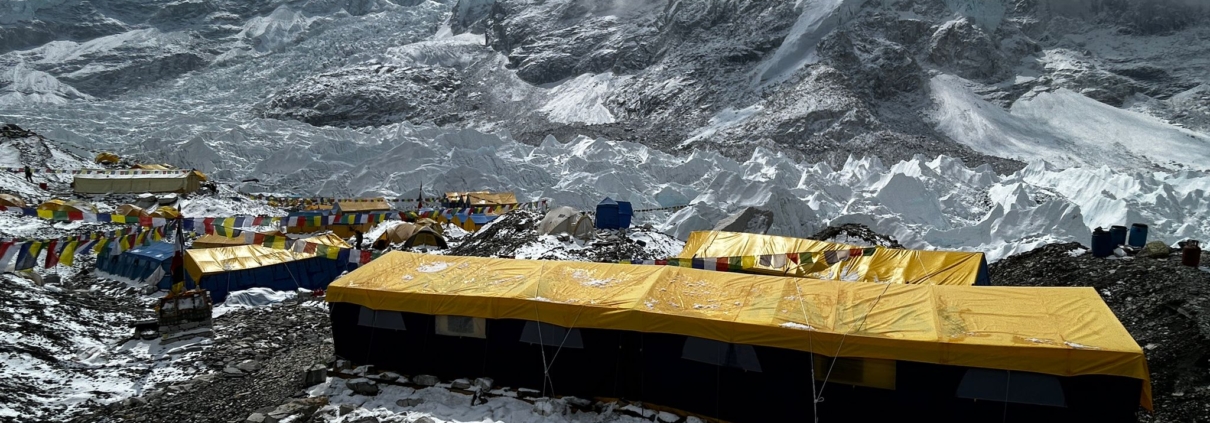 The Madison Mountaineering base camp with a dusting of snow beneath Mount Everest and Nuptse.