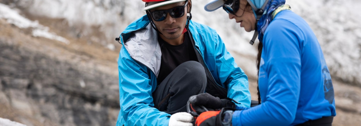 Ming Dorchi, a member of our Sherpa team, working with our climber, Sara. (Photo by Terray Sylvester)