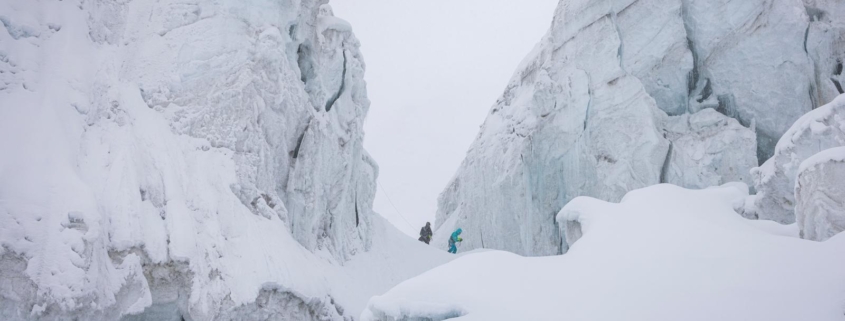 Two of our team members amid dramatic scenery above Camp 1. (Photo by Terray Sylvester)