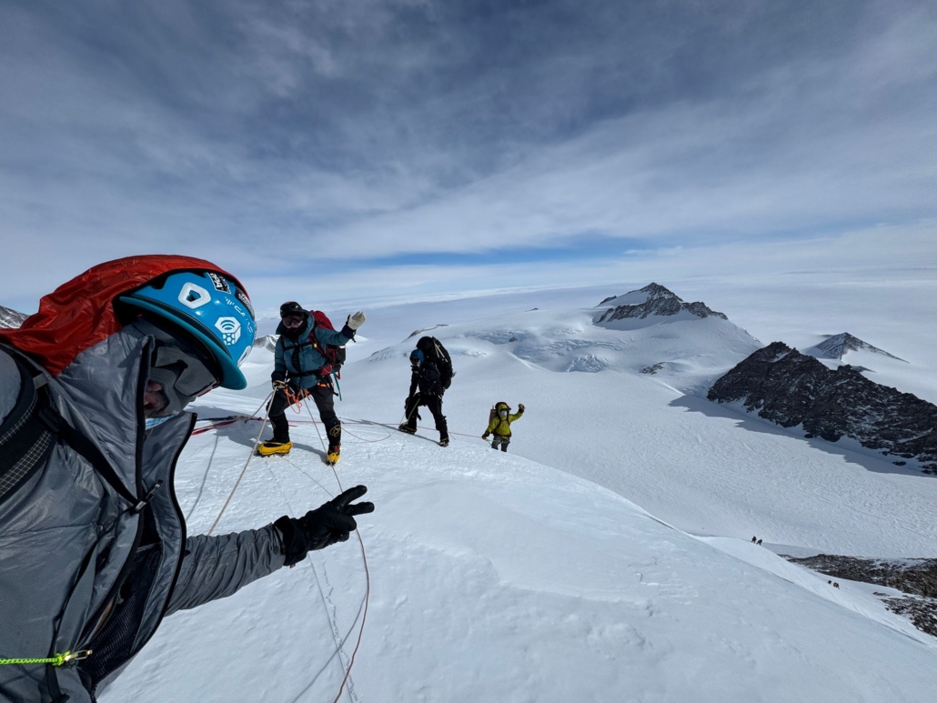 The team on their way up with the expansive Antarctic landscape stretching as far as the eye can see!