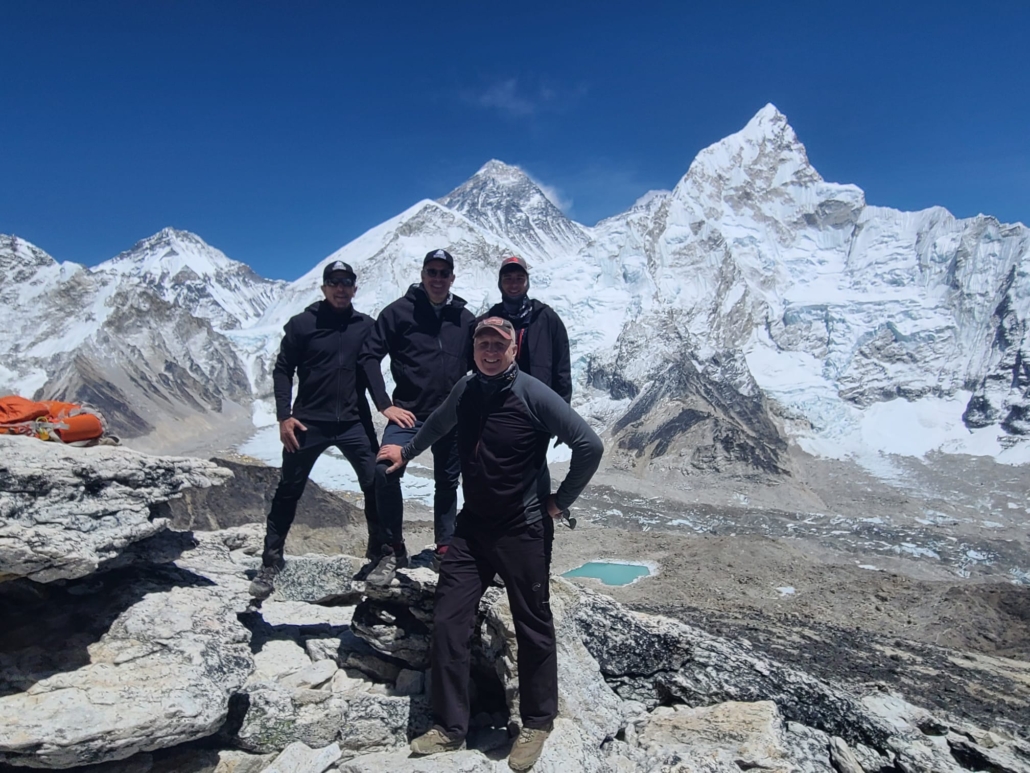 Some of our team posing in front of Everest, Lhotse, and Nuptse!