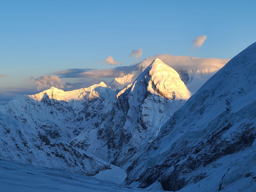 Alpenglow on peaks surrounding.