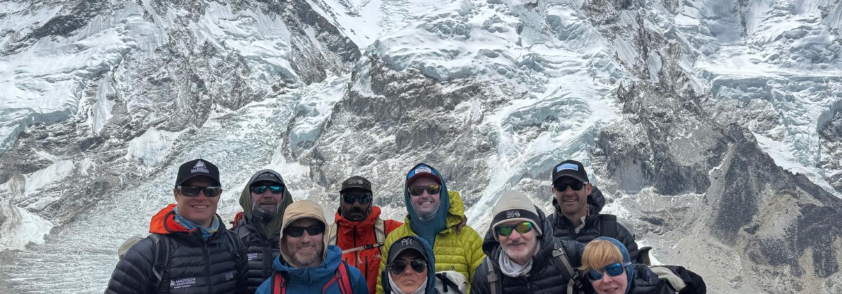 The team together on an acclimatization hike above Everest Base Camp with Everest, Lhotse, and Nuptse behind.